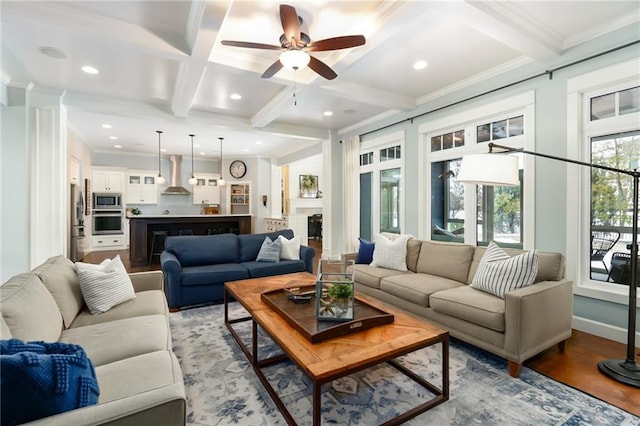 living room featuring crown molding, a ceiling fan, beamed ceiling, and coffered ceiling
