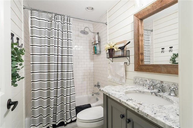 full bath with vanity, toilet, and shower / tub combo
