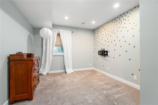 empty room with recessed lighting, baseboards, and light colored carpet