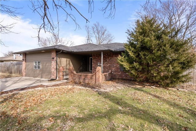 view of home's exterior featuring a patio area and a yard