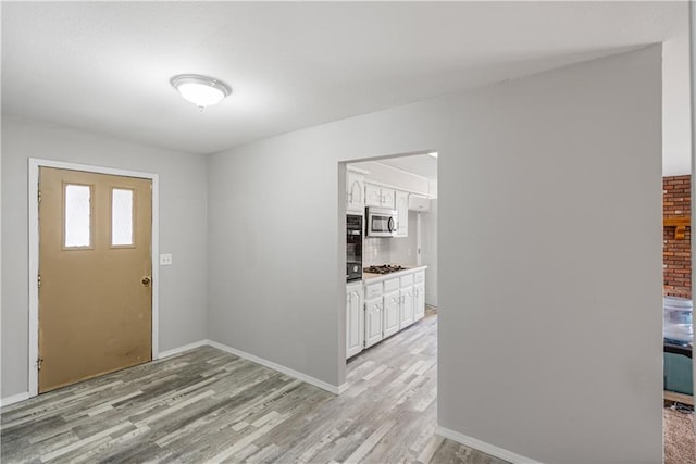 entrance foyer featuring light wood-type flooring