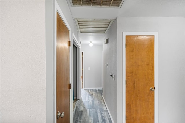 hall with hardwood / wood-style floors