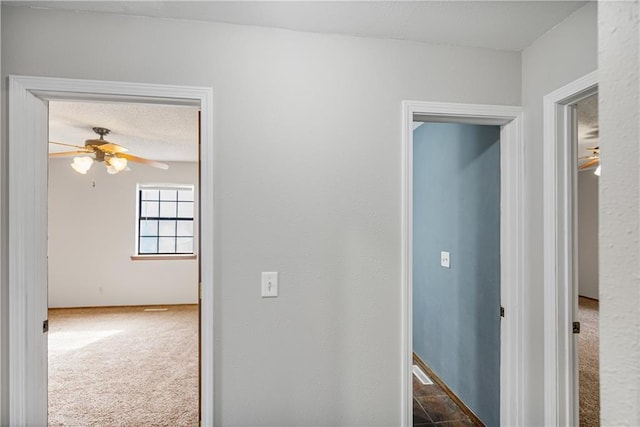 corridor with carpet flooring