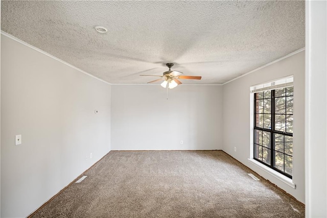 carpeted empty room with a textured ceiling, ornamental molding, and ceiling fan