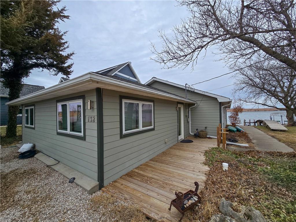 view of side of home featuring a wooden deck