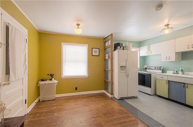 kitchen featuring hardwood / wood-style flooring, white appliances, and white cabinets