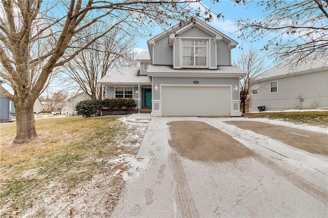 view of front of house with a front lawn and a garage