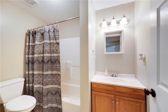 full bathroom with toilet, a textured ceiling, shower / bath combo with shower curtain, and vanity