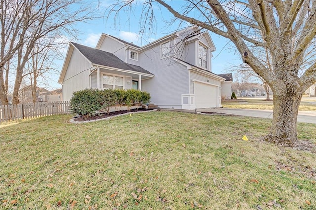 view of home's exterior featuring a lawn, driveway, an attached garage, and fence