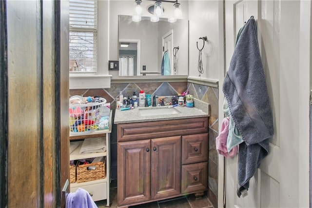 bathroom with tile walls, backsplash, and vanity