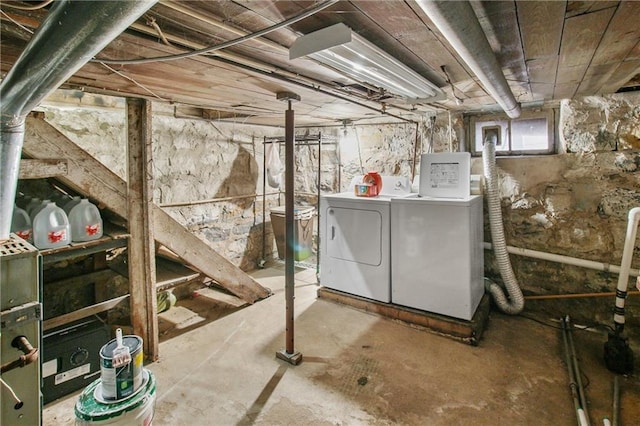 basement featuring washing machine and clothes dryer