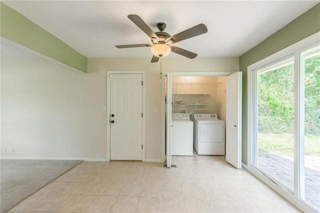 11413 Palmer Ave, Kansas City, MO 64134 - laundry room featuring washer and clothes dryer, ceiling fan, and light tile patterned floors