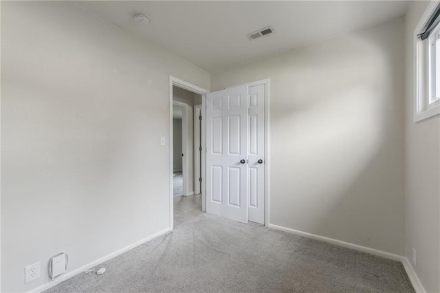 11413 Palmer Ave, Kansas City, MO 64134 - unfurnished room featuring a smoke detector and carpet