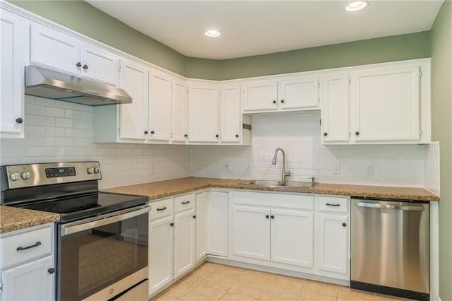 11413 Palmer Ave, Kansas City, MO 64134 - kitchen featuring appliances with stainless steel finishes, under cabinet range hood, white cabinets, and recessed lighting