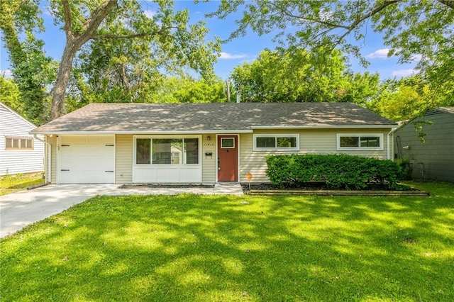 11413 Palmer Ave, Kansas City, MO 64134 - single story home with a front yard, driveway, and a garage