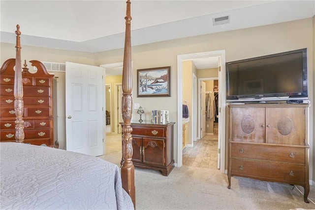 bedroom with light carpet, baseboards, and visible vents