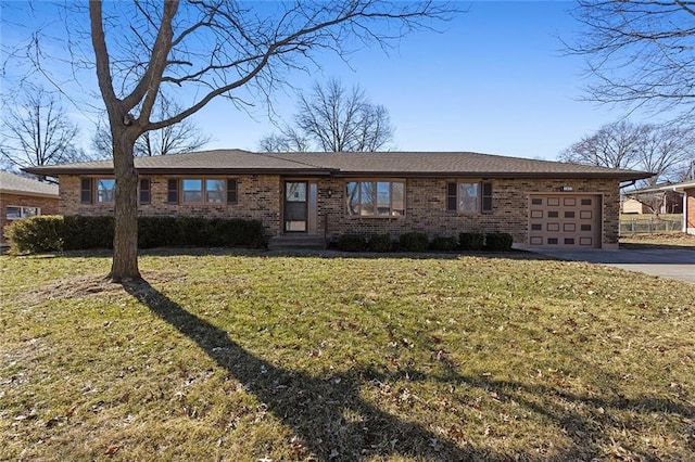 ranch-style house with a garage, driveway, brick siding, and a front yard