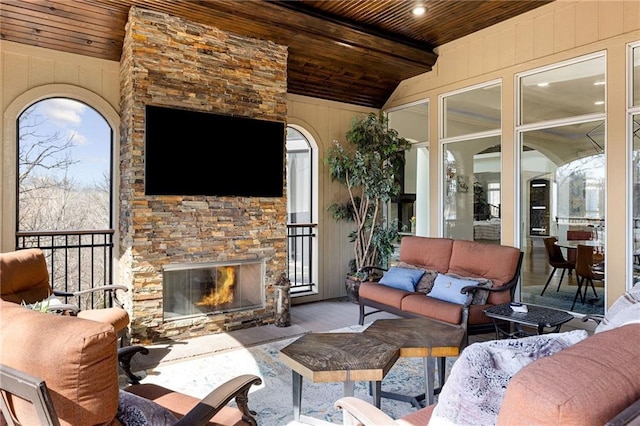 view of patio / terrace with an outdoor living space with a fireplace