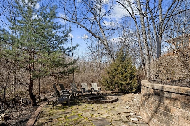 view of patio with a fire pit