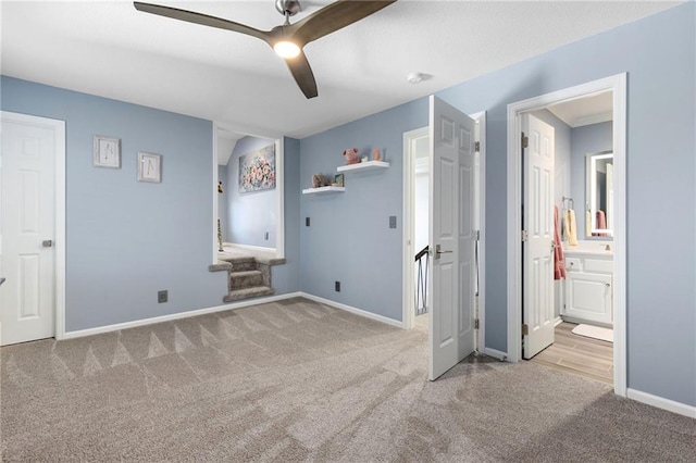 unfurnished bedroom with ceiling fan, connected bathroom, baseboards, and carpet floors