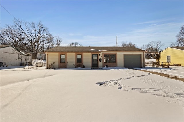 single story home featuring an attached garage