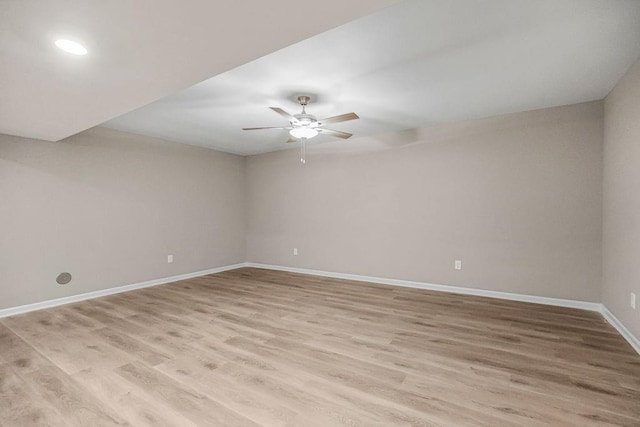 spare room with light hardwood / wood-style flooring and ceiling fan