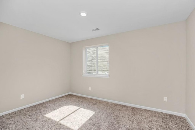 unfurnished room featuring carpet flooring