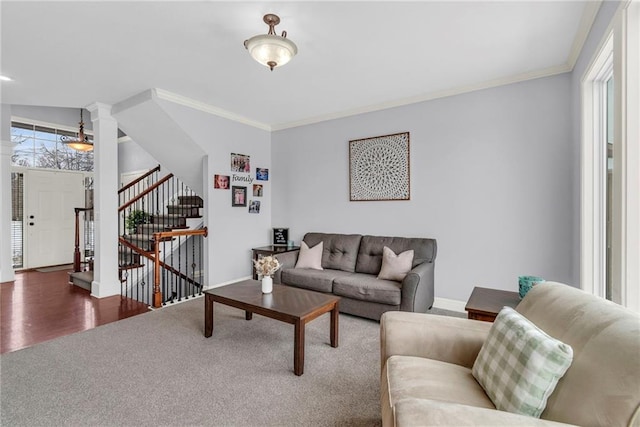 living room with ornamental molding, stairway, and a wealth of natural light