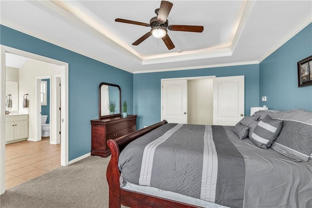 tiled bedroom with baseboards, carpet floors, a raised ceiling, and crown molding