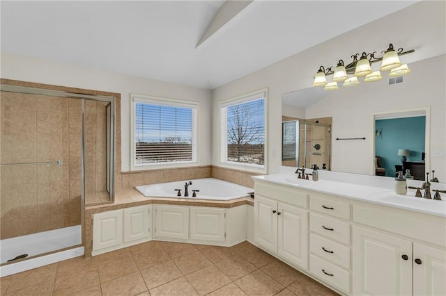 bathroom with visible vents, a garden tub, tile patterned flooring, a shower stall, and a sink