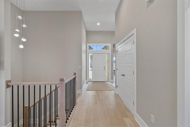 entrance foyer with light wood-type flooring and baseboards