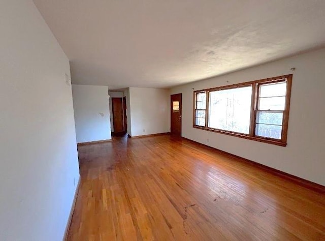 spare room with light hardwood / wood-style flooring