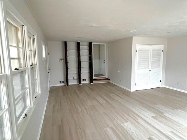 spare room with light hardwood / wood-style flooring