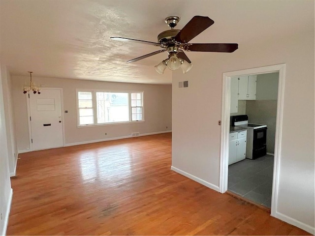 unfurnished room with ceiling fan and light hardwood / wood-style floors