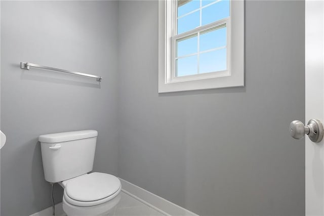 12414 Adam St, Excelsior Springs, MO 64024 - bathroom featuring baseboards and toilet