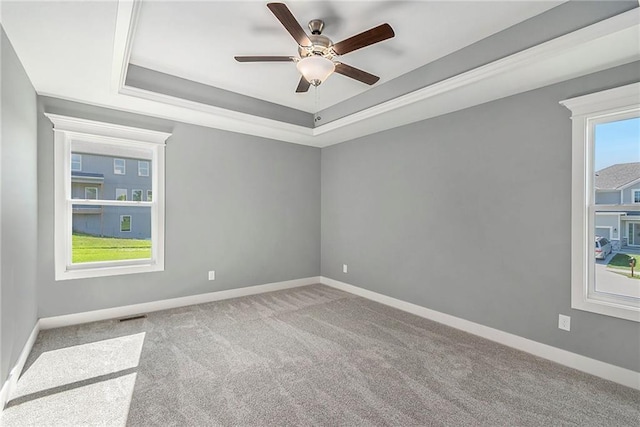 12414 Adam St, Excelsior Springs, MO 64024 - carpeted empty room featuring a ceiling fan, a raised ceiling, and baseboards