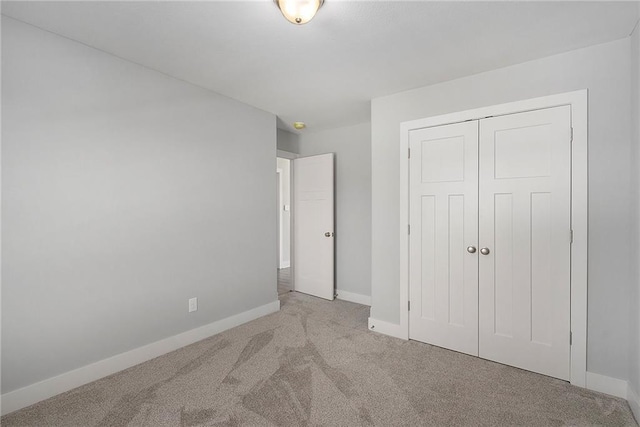 12414 Adam St, Excelsior Springs, MO 64024 - unfurnished bedroom with carpet floors, baseboards, and a closet
