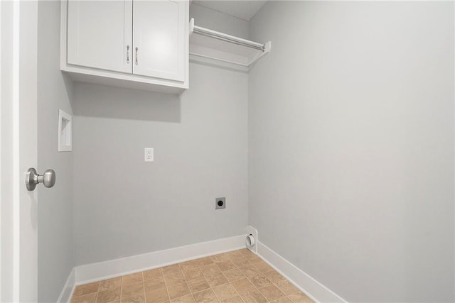 12414 Adam St, Excelsior Springs, MO 64024 - clothes washing area featuring hookup for an electric dryer, baseboards, and cabinet space