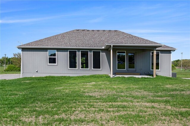 12414 Adam St, Excelsior Springs, MO 64024 - back of property featuring a yard and a shingled roof