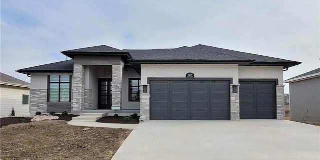 prairie-style home featuring a garage