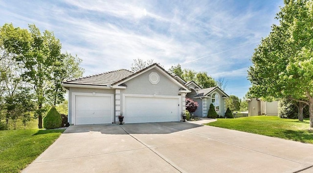 single story home with stucco siding, concrete driveway, a front yard, a garage, and a tiled roof