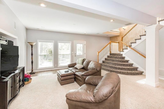 living room with recessed lighting, baseboards, ornate columns, and stairs