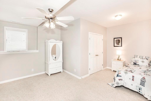 bedroom with ceiling fan, visible vents, and baseboards