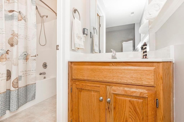 full bathroom featuring vanity, shower / bath combo with shower curtain, and tile patterned floors