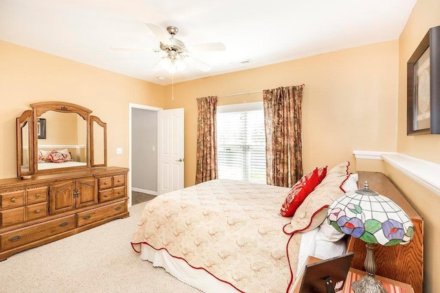 carpeted bedroom featuring a ceiling fan