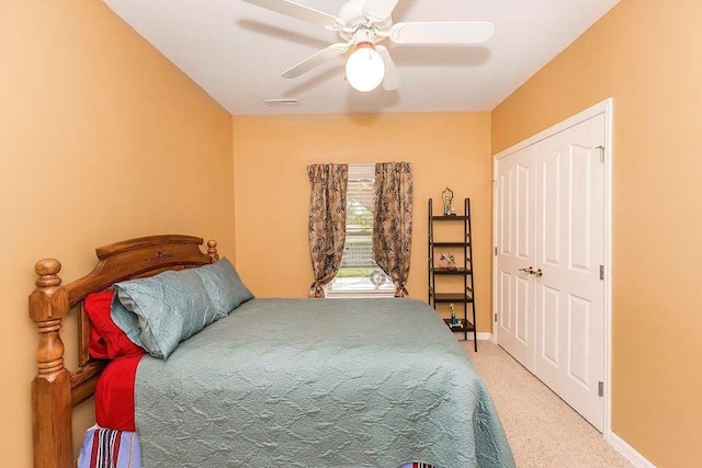 bedroom with carpet floors, visible vents, baseboards, and a ceiling fan