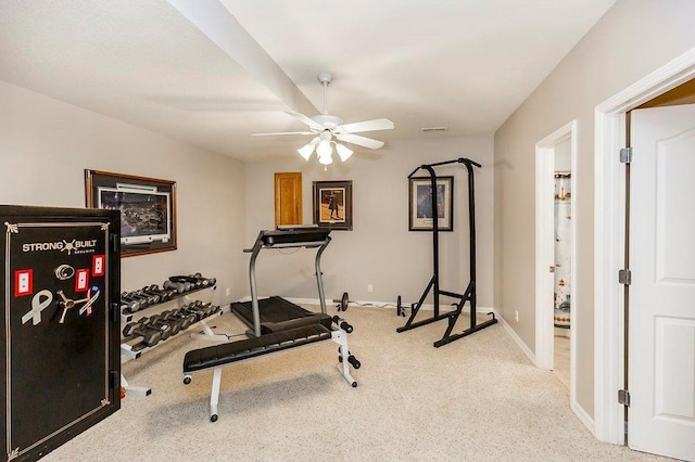 workout room with ceiling fan, light colored carpet, visible vents, and baseboards