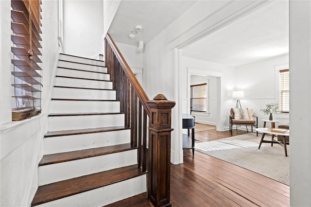 staircase featuring hardwood / wood-style floors