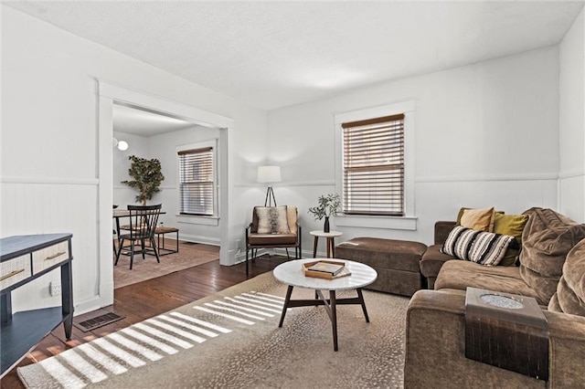 living room with dark hardwood / wood-style floors