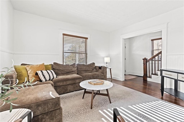 living room with dark hardwood / wood-style flooring and plenty of natural light